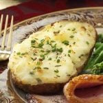 Originally published as Cheese-Stuffed Twice-Baked Potatoes in Taste of Home's Holiday & Celebrations Cookbook Annual 2011, p10